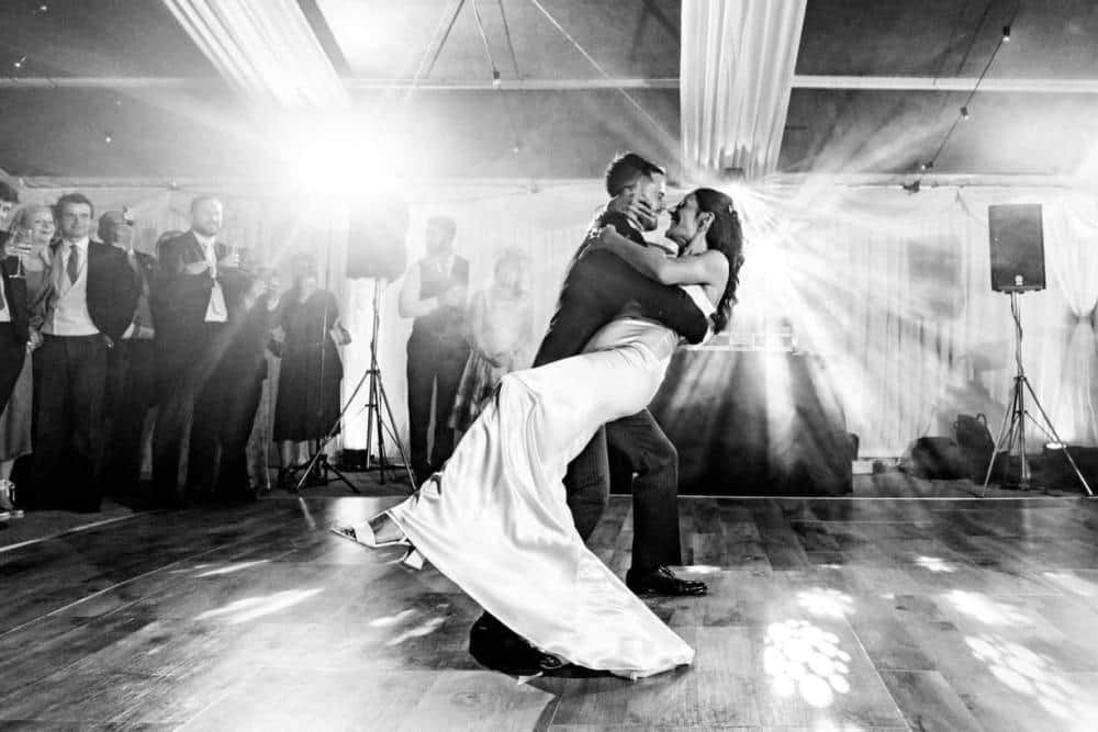 Emily and Tom's wedding reception with stunning atmospheric lighting design creating a magical evening ambiance