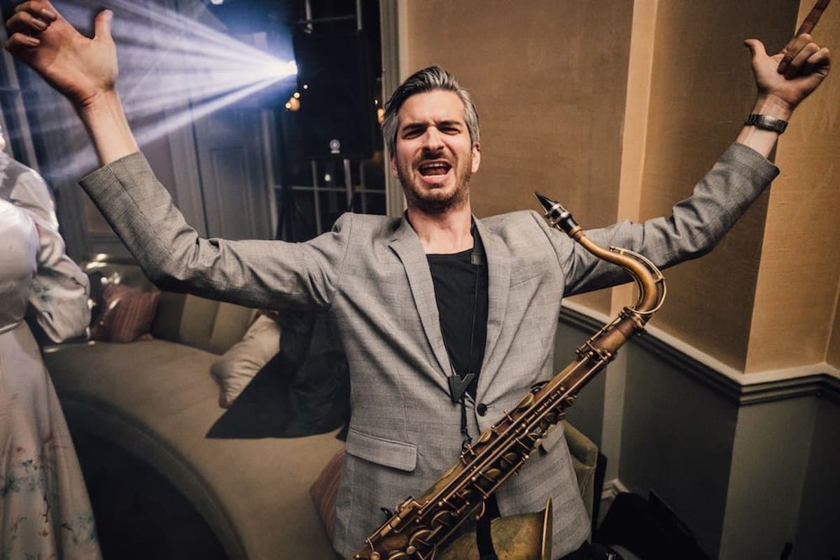 Live saxophone player performing at a wedding celebration