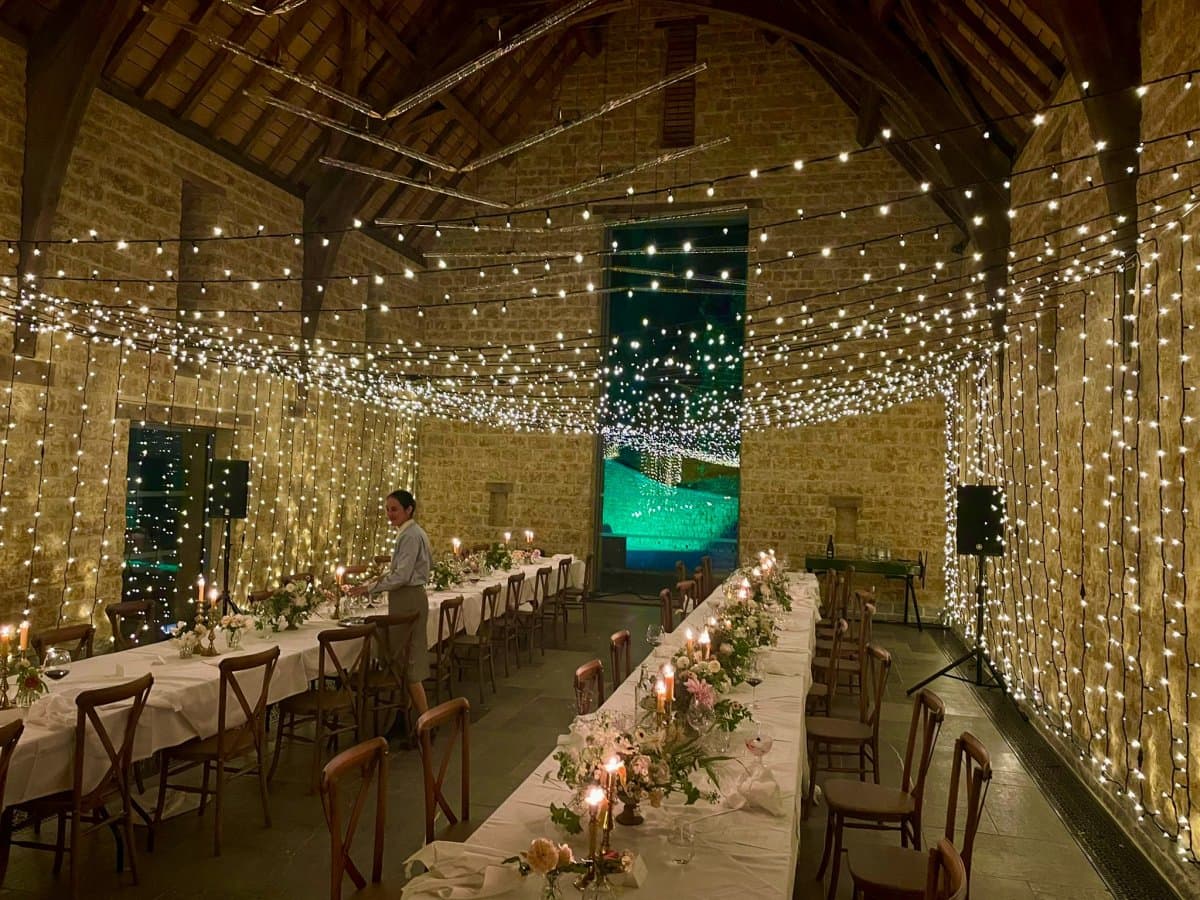 Fairy light tunnel and atmospheric party lighting at a prestigious Somerset celebration