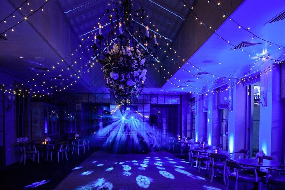 Orangery venue with violet lighting and elegant styling creating a romantic atmosphere