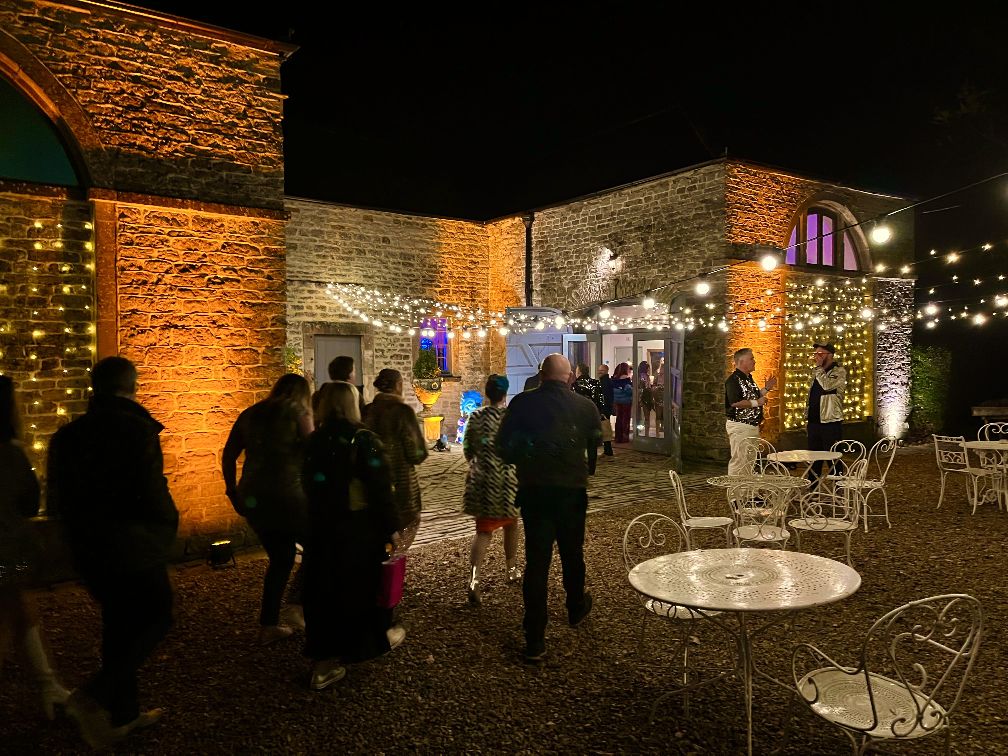 Pennard House amber uplighting highlighting architectural features for elegant evening events