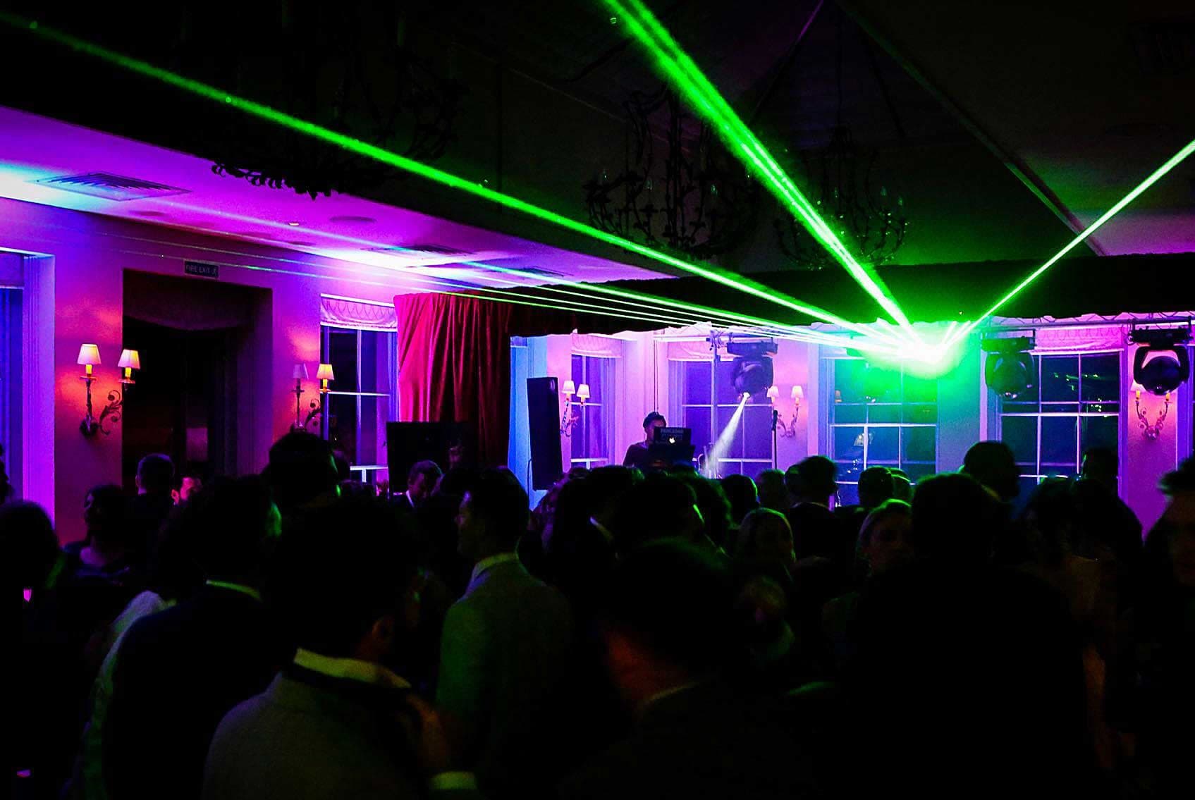 Professional laser lighting effects creating spectacular visual displays for party celebrations