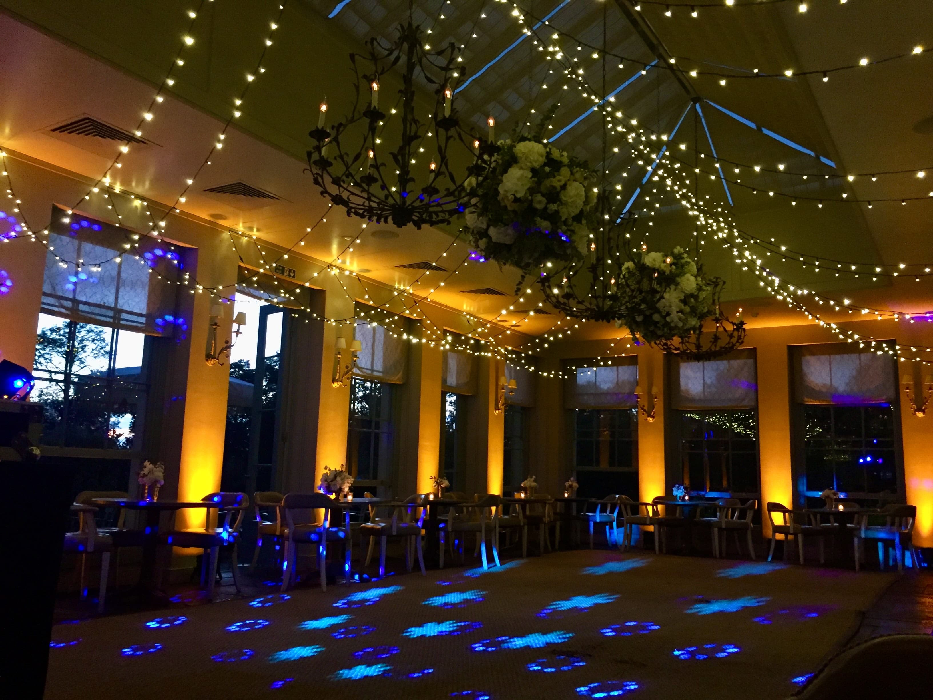 Professional wedding venue styling with atmospheric lighting and elegant decoration