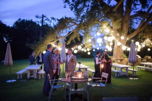 Image of a group of people with festoon wedding lighting