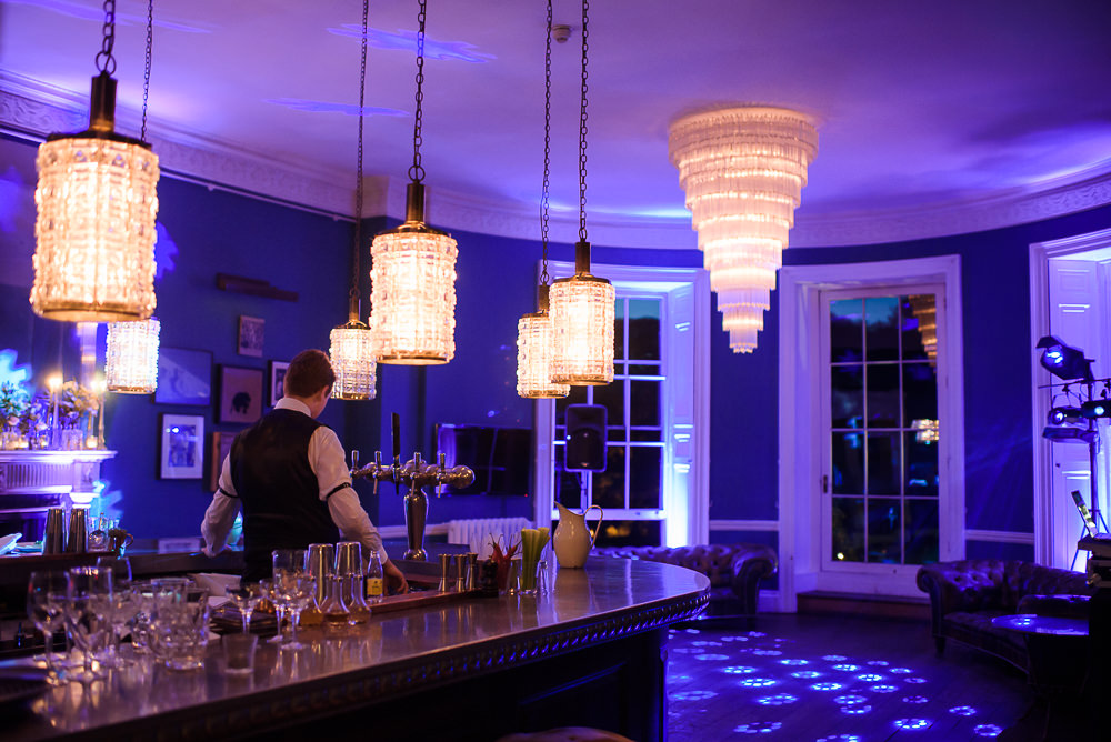 Babington House Bar with mood lighting and DJ lighting.
