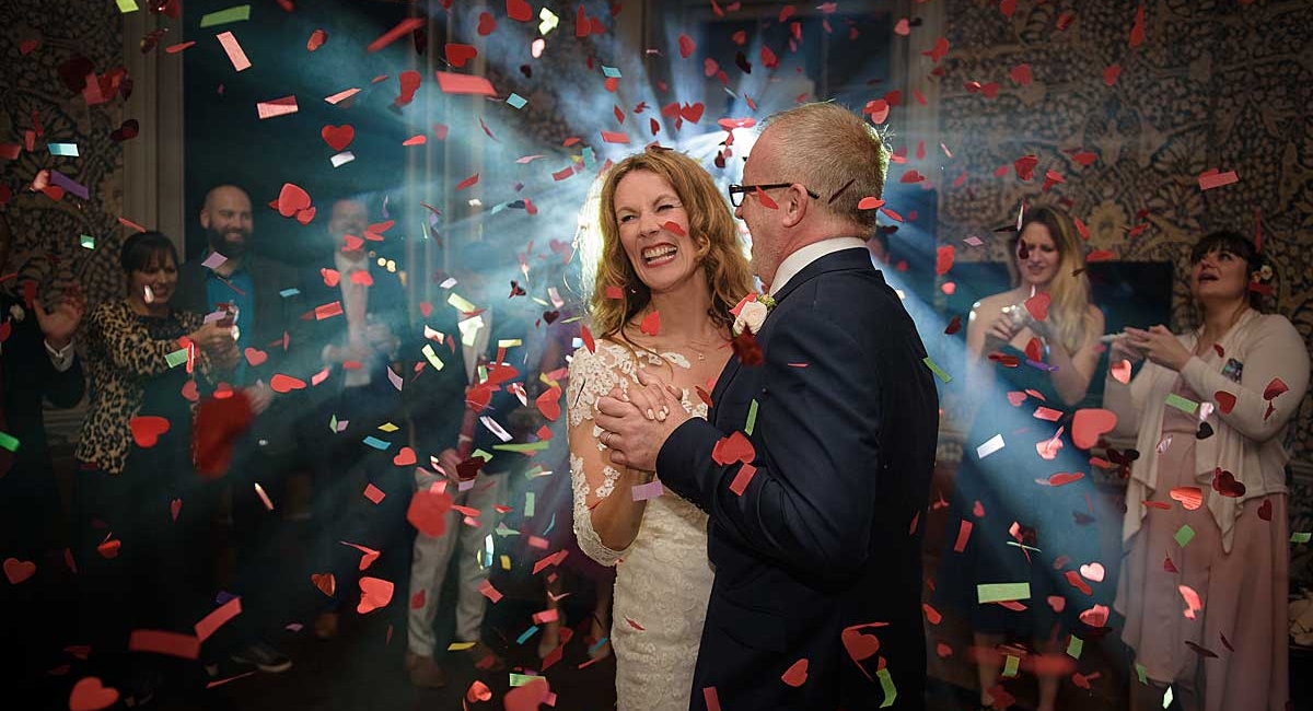 First-Dance-with-confetti bride and groom dancing with confetti cannon explosion