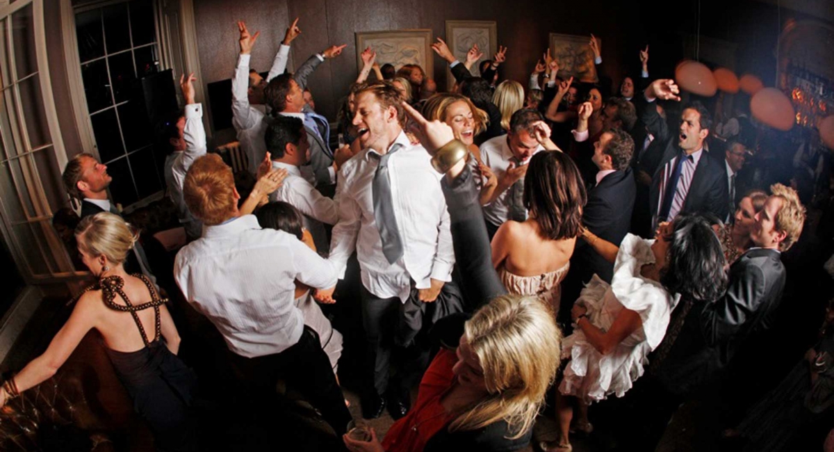 Babington House Somerset Bar Wedding Party with Arms in the air.